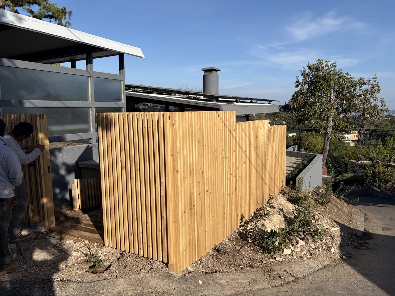 Cedar privacy fence, hillside home