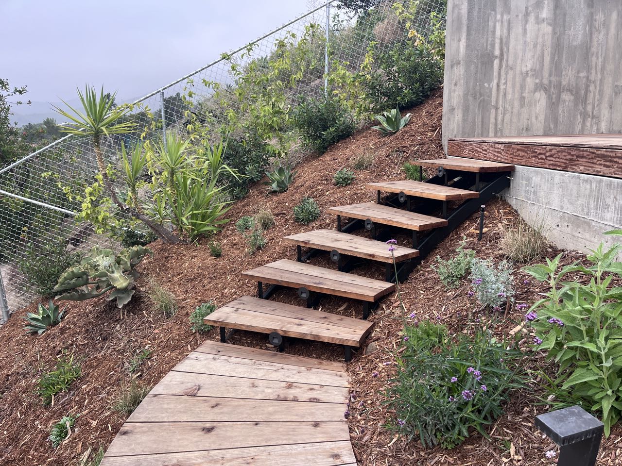 Floating wood steps, hillside garden