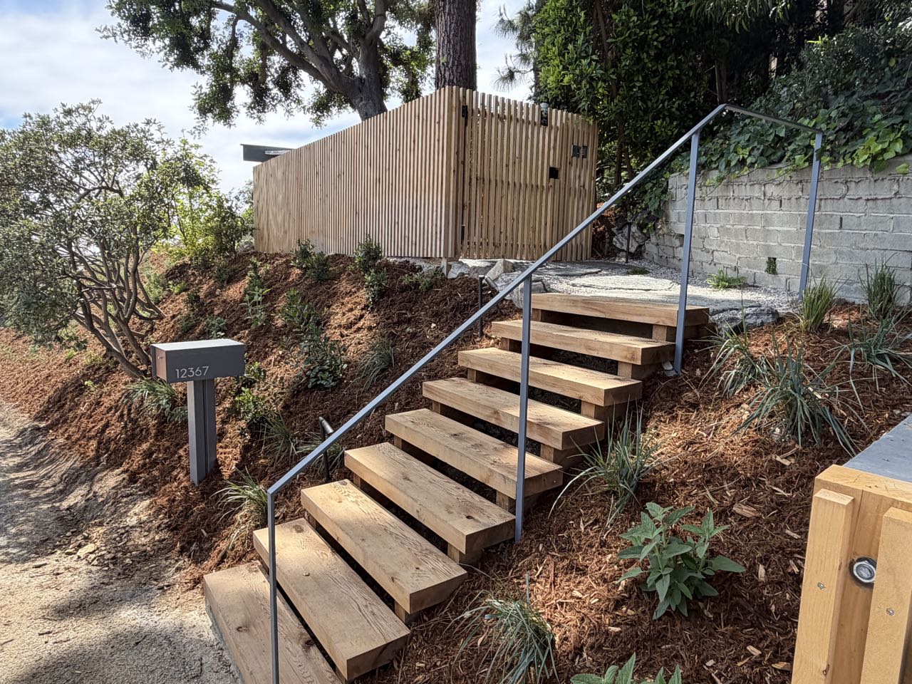 Wood steps with steel handrail